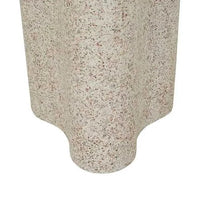 Close-up of Globe West Artie Outdoor Wave Side Table in warm sand fibrestone with wave design and textured surface