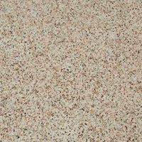 Close-up of warm sand fibrestone surface with speckled pattern on Artie Outdoor Wave Side Table top