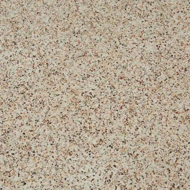 Close-up of warm sand fibrestone surface with speckled pattern on Artie Outdoor Wave Side Table top