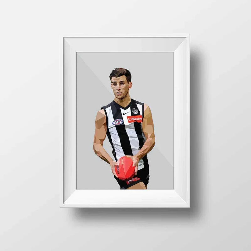 Framed Dom Gauci Kids Art Print of Nick Daicos in Collingwood AFL football uniform holding a red ball on grey background