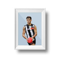 Framed Dom Gauci kids art print of Nick Daicos in Collingwood AFL football uniform holding a ball on powder blue background