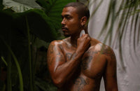 Man using White Jade Sculpting Tool on neck and shoulder for facial and body sculpting