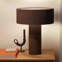 POTT Lighting Terra Table Lamp in combo chocolate with textured handmade clay design on wooden table