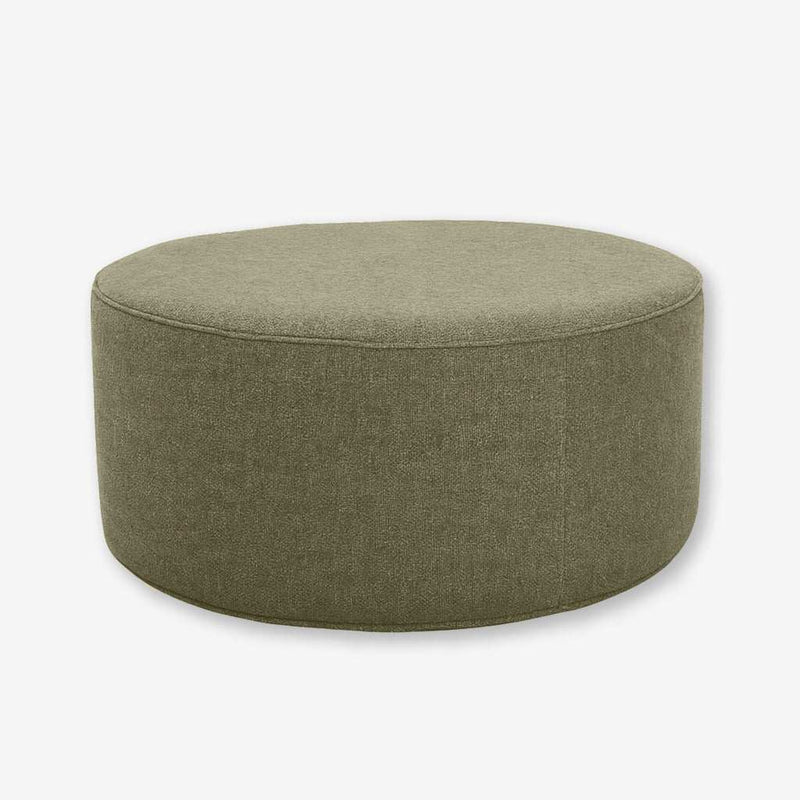 Round Verde Olive upholstered ottoman with soft fabric and customizable piping options
