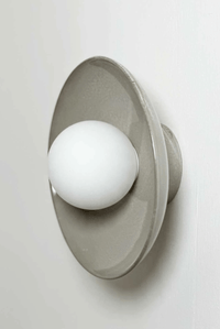Robert Gordon Dish Wall Sconce ceramic hand glazed with white globe light mounted on wall