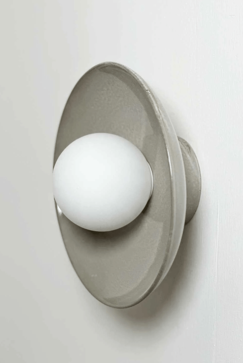 Robert Gordon Dish Wall Sconce ceramic hand glazed with white globe light mounted on wall