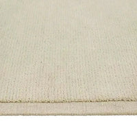 Close-up of GlobeWest Bower Frame Rug in Cloud color with hand-woven wool texture