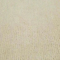 GlobeWest Bower Frame Rug in cloud color handwoven wool texture close-up