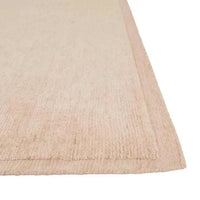 GlobeWest Bower Frame Rug in rose color, hand-woven wool with simple framed design.