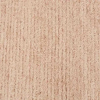 Close-up of the soft, hand-woven GlobeWest Bower Frame Rug in rose-colored 100% wool texture
