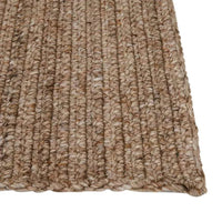 Close-up of tawny GlobeWest Harbour Knot outdoor rug with hand-woven textured 100% PET yarn design