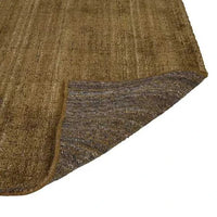 Olive hand-woven GlobeWest Tepih Dune Rug made of wool blend with subtle textured pattern, indoor use, corner flipped showing backside texture