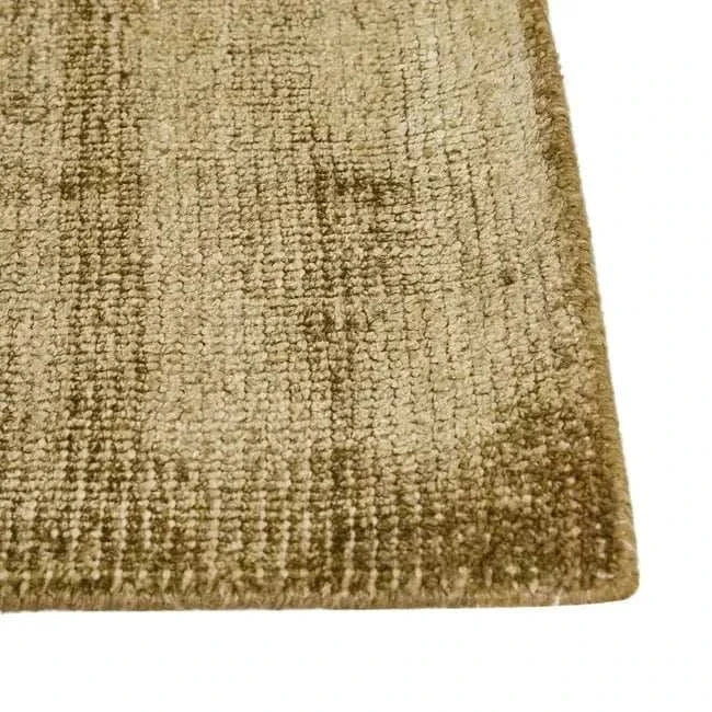 Close-up of GlobeWest Tepih Neptune hand-woven olive wool blend rug with subtle textured pattern