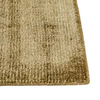 Close-up of GlobeWest Tepih Neptune hand-woven olive wool blend rug with subtle textured pattern