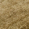 Close-up of GlobeWest Tepih Neptune Rug in olive with hand-woven wool, silk, and cotton texture