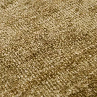 Close-up of GlobeWest Tepih Neptune Rug in olive, hand-woven wool, silk, and cotton blend with textured rustic finish.