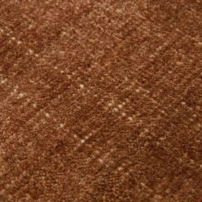 Close-up of GlobeWest Tepih Neptune Round Rug in ginger color showing textured woven fabric