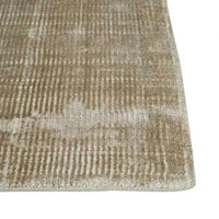 GlobeWest Tepih Tide Rug in oyster color with subtle ripple pattern, hand-woven viscose and wool blend, indoor use.