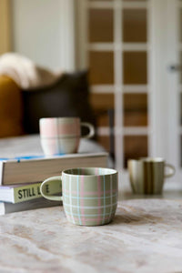 Robert Gordon Mug with hand-painted sage and blush check tartan design on ceramic stoneware, microwave and dishwasher safe.