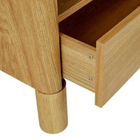 Close-up of GlobeWest Artie Open Bedside drawer and rounded pillar leg in natural ash veneer wood