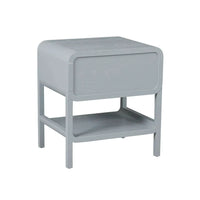 Charles Bedside in dusty blue with soft waterfall edges, leather handle, one drawer, and suspended shelf