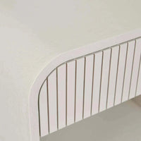 Close-up of the bone-colored Globe Chloe Bedside drawer with ash veneer and slatted design