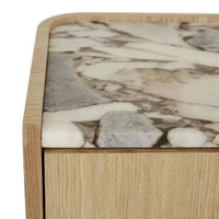 Close-up of GlobeWest Elsie Bedside featuring a matt ocean marble top with natural ash veneer sides and rounded corners.