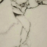 Close-up of GlobeWest Oberon Crescent bedside table with white Carrara marble top featuring natural veining