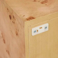 Close-up of Trove Burl Bedside Table corner showing light burl veneer with natural grain patterns and safety anchor kit