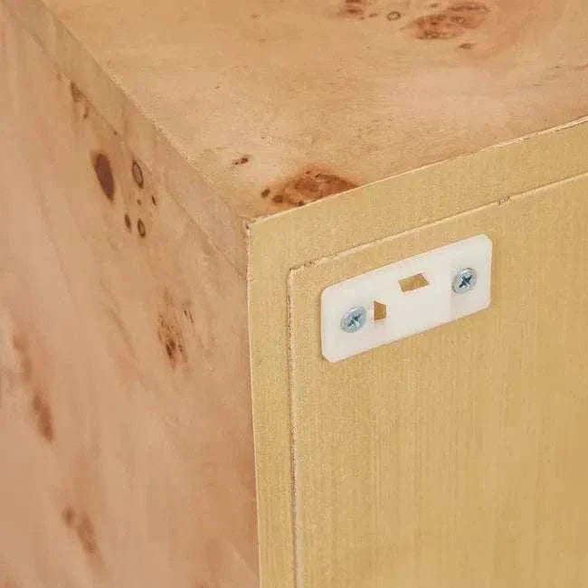Close-up of Trove Burl Bedside Table corner showing light burl veneer with natural grain patterns and safety anchor kit