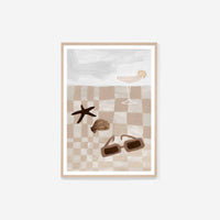 Middle of Nowhere Summer Picnic 2 framed print featuring neutral beige checkered pattern with sunglasses, seashell, starfish, and cocktail glass in oak frame