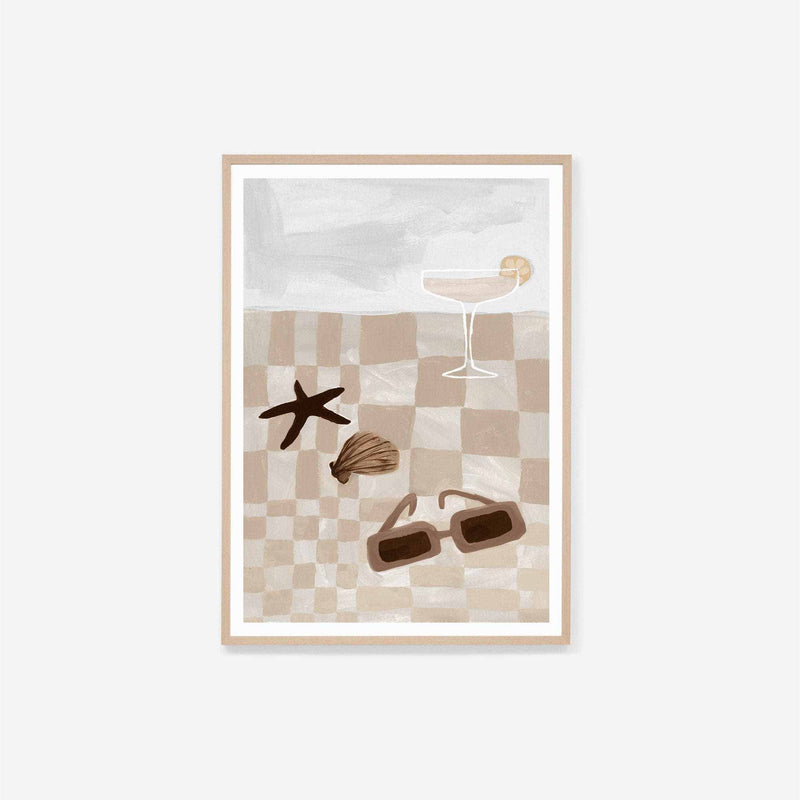 Middle of Nowhere Summer Picnic 2 framed print featuring neutral beige checkered pattern with sunglasses, seashell, starfish, and cocktail glass in oak frame