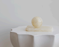 CoTheory Orbit Table Sculpture small white onyx sphere on rectangular base on white sculpted table