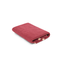 Loop Home Bath Mat in ruby and almond blush pinstripe, made of GOTS organic cotton with jacquard weave, 80x60 cm size.