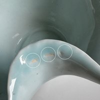 Close-up of a ceramic product with imperfections highlighted
