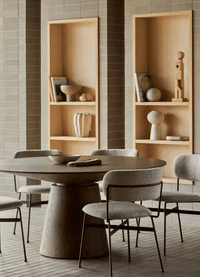 GlobeWest Boden Stripe Bud Vase in blush pink on wooden shelf in modern dining room setting