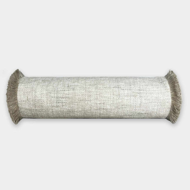 Maxima bolster cushion in stone color with fringe detailing from norsu STUDIO Forma Collection