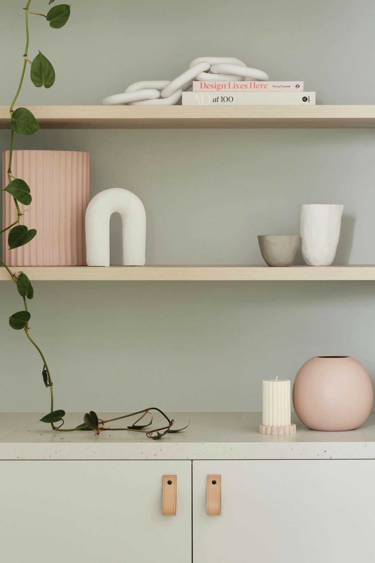 minimalist styled shelves with decorative objects and soft pastel accents