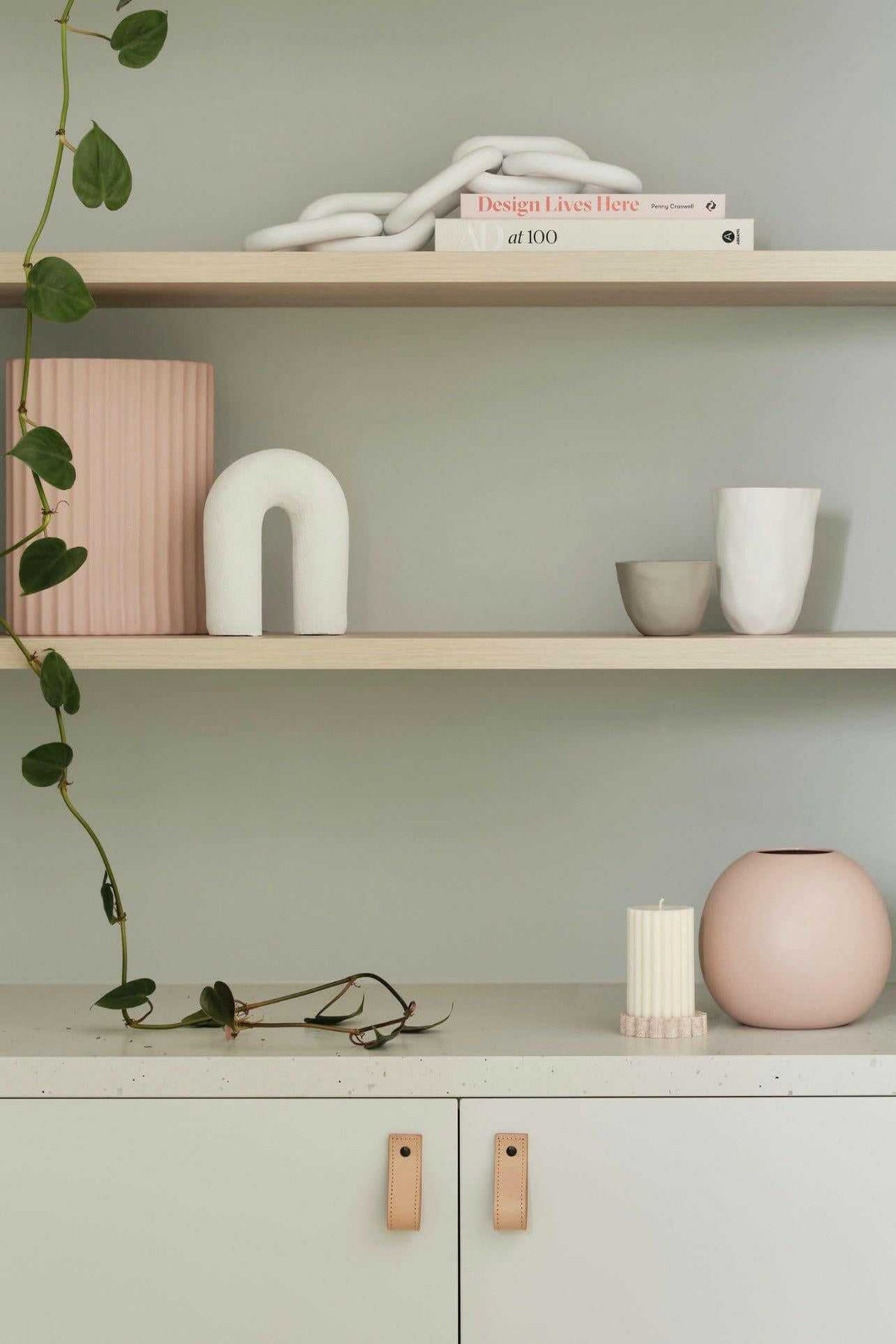 minimalist styled shelves with decorative objects and soft pastel accents