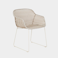 GlobeWest Cabana Link dining armchair with linen sand woven resin seat and metal frame