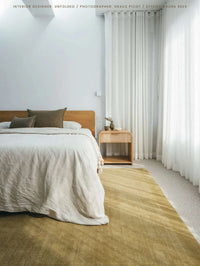 Tait Rug Pistachio color hand-loomed New Zealand wool with textured finish in modern home setting