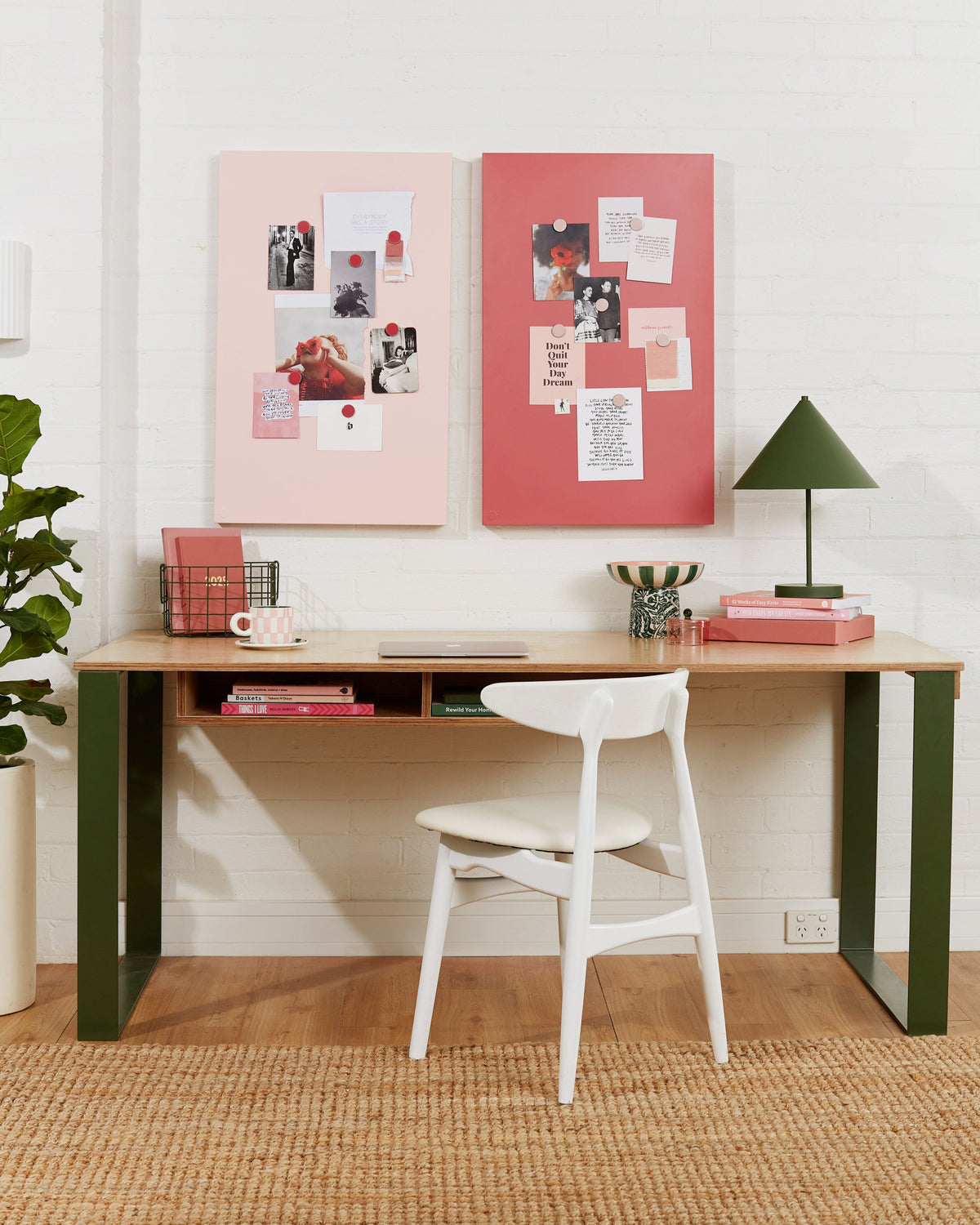 Modern home office with a wooden desk, white chair, and decorative elements.