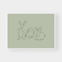 Gigi's Rabbits tonal green wall art with three minimalist outlined rabbits on muted green background