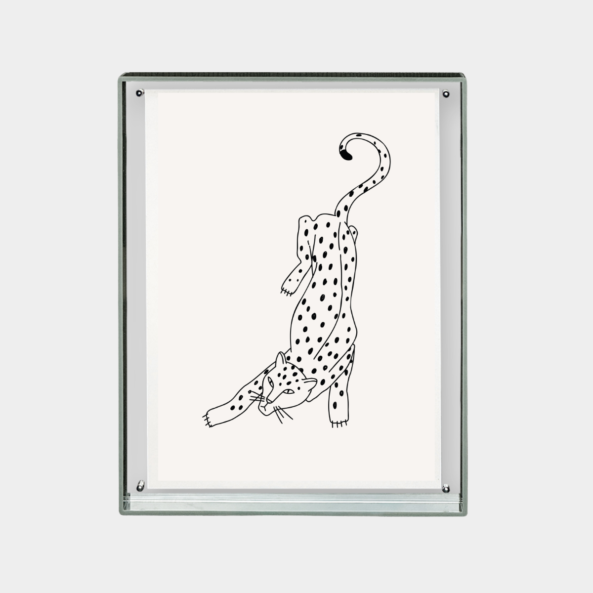 Minimalist black and white digital print of a stretching spotted leopard on a white background in a glass frame