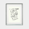 framed digital print with inspirational quote about noticing light in little things in black text on white background