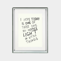 framed digital print with inspirational quote about noticing light in little things in black text on white background