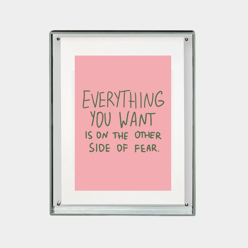 motivational digital print with quote everything you want is on the other side of fear on pink background in frame