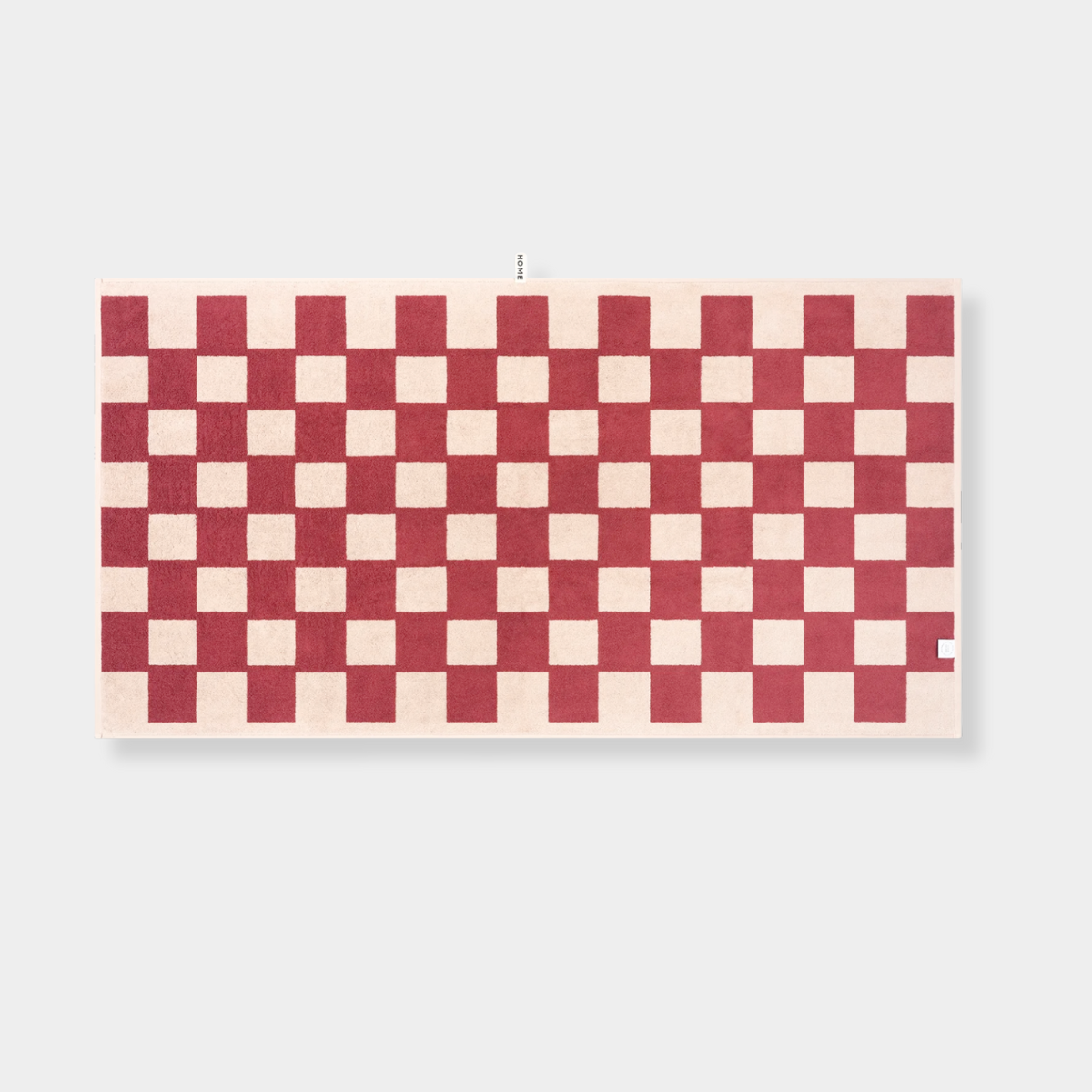 Loop Home Bath Sheet in Ruby and Almond Blush brick checkered pattern, made from GOTS organic cotton with jacquard weave, 170x90cm size.