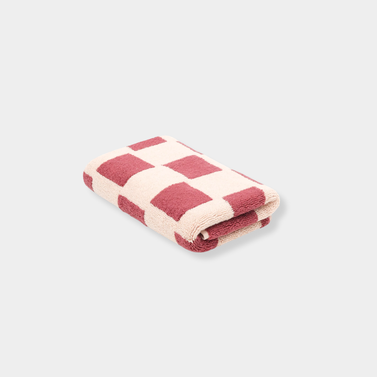 Folded Loop Home Hand Towel in ruby and almond blush brick checkered pattern made from GOTS organic cotton with jacquard weave.