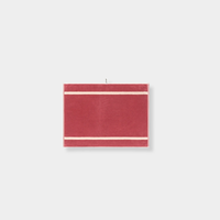 Loop Home Bath Mat in ruby and almond blush colors with pinstripe design, made from GOTS organic cotton and jacquard weave, sized 80x60 cm.